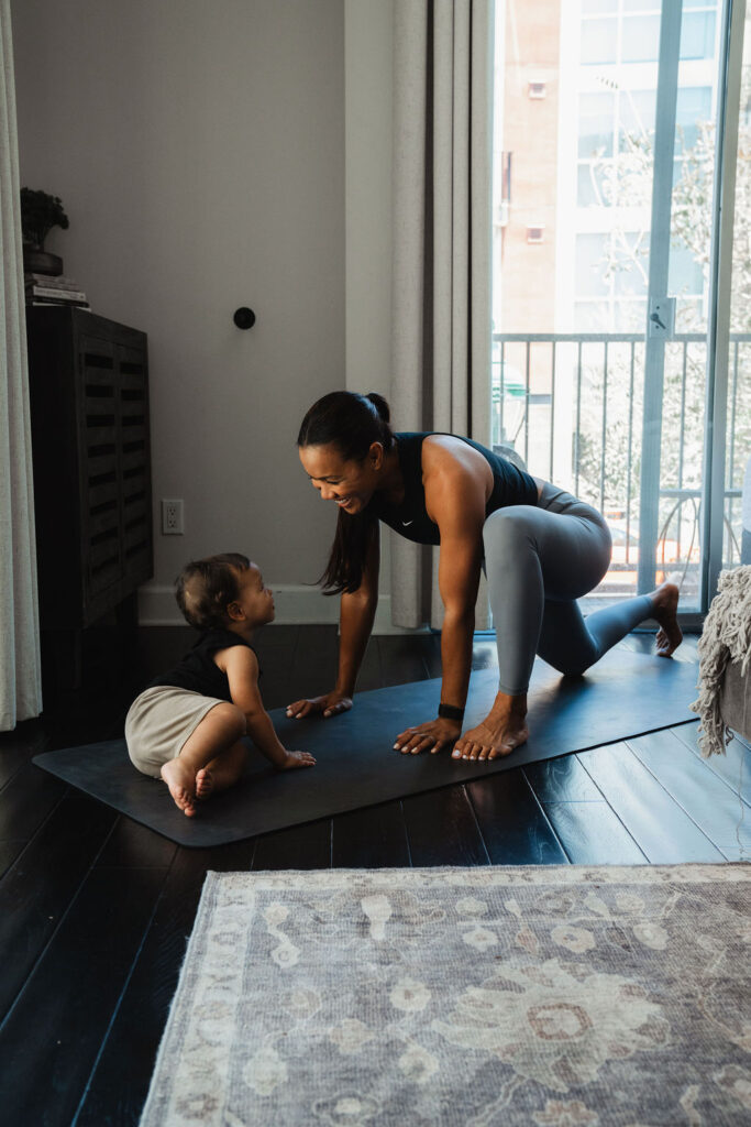 maricris-mat-with-baby Maricris on a yoga mat at home with her baby daughter beside her