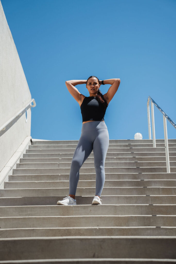 maricris-stairs-sky Maricris stretching on outdoor stairs under a blue sky